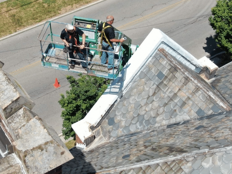 roof experts looking for leaks.